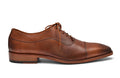 Brown leather dress shoe on a white background